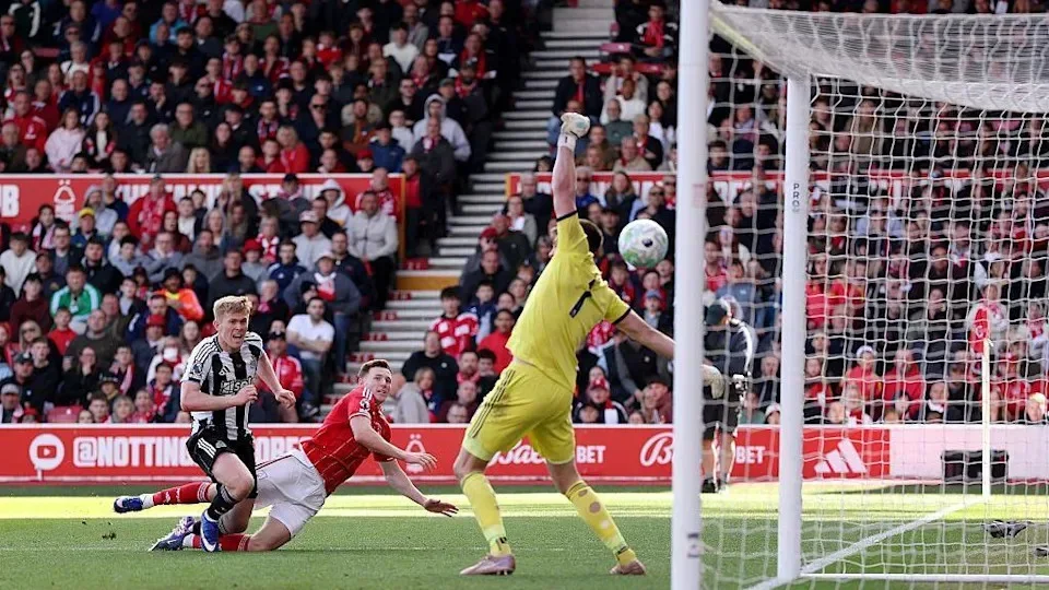 Lewis Hall unsuccessfully attempting to stop Elliot Anderson scoring for Nottingham Forest against Newcastle